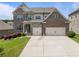Charming brick two-story home featuring a two-car garage and well-maintained landscaping at 4154 Hawking Dr, Suwanee, GA 30024