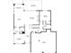 First floor plan showcasing the kitchen, living room, dining room, garage, and covered deck at 4154 Hawking Dr, Suwanee, GA 30024