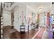 Welcoming foyer with hardwood floors, a staircase, and stylish decor at 4154 Hawking Dr, Suwanee, GA 30024