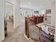 Hallway with wood railing, carpet, and neutral paint at 4154 Hawking Dr, Suwanee, GA 30024
