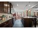 Spacious kitchen with granite countertops, stainless steel appliances, and dark wood cabinetry at 4154 Hawking Dr, Suwanee, GA 30024