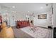 Cozy living room featuring a decorative rug, a comfortable sofa, and natural lighting at 4154 Hawking Dr, Suwanee, GA 30024
