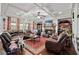 Cozy living room featuring coffered ceilings, a fireplace, and comfortable seating at 4154 Hawking Dr, Suwanee, GA 30024