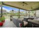 Relaxing screened-in patio with comfortable seating, overhead fans, and a view of the backyard at 4154 Hawking Dr, Suwanee, GA 30024