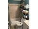 This bathroom features a combination tub and shower, with tile surround and plenty of storage at 4164 River Shoals Ct, Duluth, GA 30097