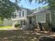 Charming two-story home with stone facade and landscaped front yard and classic black shutters at 4164 River Shoals Ct, Duluth, GA 30097
