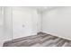 Clean bedroom features wood floors, a double closet, white walls and a single window at 6000 Malibu Drive Dr, Morrow, GA 30260