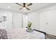 Bright bedroom featuring modern lighting, sleek closet and an ensuite bathroom at 6000 Malibu Drive Dr, Morrow, GA 30260