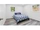 Nicely staged bedroom with hardwood floors, two windows and a double bed with decorative pillows at 6000 Malibu Drive Dr, Morrow, GA 30260