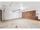 Clean garage with brick walls and two-car garage door at 6000 Malibu Drive Dr, Morrow, GA 30260