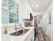 Bright kitchen features quartz counters, stainless appliances, and durable flooring at 6000 Malibu Drive Dr, Morrow, GA 30260