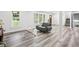 Bright living room boasts hardwood floors, lots of natural light, and neutral paint at 6000 Malibu Drive Dr, Morrow, GA 30260