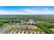 An aerial view of the property's neighborhood and proximity to a nearby lake, surrounded by beautiful, lush woodlands at 87 Rushing View Gln, Dallas, GA 30157