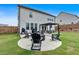 Inviting backyard features a fire pit area, pergola, and lush green lawn, perfect for entertaining and relaxation at 87 Rushing View Gln, Dallas, GA 30157