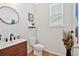 Chic powder room with modern fixtures, sleek vanity, and decorative wall accents at 87 Rushing View Gln, Dallas, GA 30157