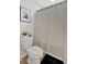 Bathroom featuring a toilet and shower with a striped curtain at 87 Rushing View Gln, Dallas, GA 30157