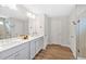 Modern bathroom featuring double vanity, large mirror and walk-in shower at 87 Rushing View Gln, Dallas, GA 30157