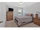 Comfortable bedroom with neutral walls and a wooden dresser at 87 Rushing View Gln, Dallas, GA 30157