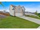 Attractive home featuring a two-car garage, a well-kept lawn, and a welcoming front porch with white columns at 87 Rushing View Gln, Dallas, GA 30157
