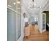 Bright foyer with hardwood floors, modern chandelier, and view into a welcoming living space at 87 Rushing View Gln, Dallas, GA 30157