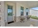 Inviting front porch with comfortable seating and stylish decor, perfect for relaxing outdoors at 87 Rushing View Gln, Dallas, GA 30157