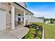 Welcoming front porch with decorative flower bed and a charming seating area at 87 Rushing View Gln, Dallas, GA 30157