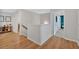 Upstairs hallway with hardwood floors offering access to various rooms in the home at 87 Rushing View Gln, Dallas, GA 30157