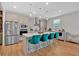 Modern kitchen with stainless steel appliances, island with seating, and hardwood floors at 87 Rushing View Gln, Dallas, GA 30157