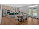 Modern kitchen with stainless steel appliances, island with seating, and hardwood floors at 87 Rushing View Gln, Dallas, GA 30157