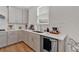 Well-lit kitchen featuring stone countertops, grey cabinetry, stainless steel appliances, and modern fixtures at 87 Rushing View Gln, Dallas, GA 30157