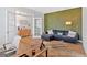 Comfortable living area with modern panel accent wall, hardwood floors, and ample seating at 87 Rushing View Gln, Dallas, GA 30157