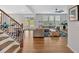 Bright and airy living area with hardwood floors, large windows, and an open floor plan at 87 Rushing View Gln, Dallas, GA 30157