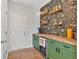 Fun pantry with unique wallpaper, floating shelves, and mini wine cooler at 87 Rushing View Gln, Dallas, GA 30157