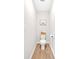 Bright powder room featuring neutral walls and wood-look floors at 87 Rushing View Gln, Dallas, GA 30157