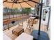 Back deck with umbrella, outdoor seating, and wooden picnic table, perfect for outdoor relaxation at 2316 Defoors Ferry Nw Rd, Atlanta, GA 30318