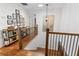 Staircase with wood treads and wrought iron railing leading to the second floor at 2316 Defoors Ferry Nw Rd, Atlanta, GA 30318