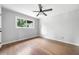 Neutral bedroom with hardwood floors, white walls, and a ceiling fan at 3068 Cherry Blossom Ln, Atlanta, GA 30344
