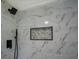 Modern bathroom with stylish marble-look tile and sleek black fixtures, including a rainfall shower head at 4176 King Edward Dr, Douglasville, GA 30135