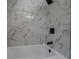 Close up view of bathroom shower with marble tile and modern shower head at 4176 King Edward Dr, Douglasville, GA 30135
