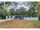 Charming white brick home features a freshly painted front and manicured lawn at 4176 King Edward Dr, Douglasville, GA 30135