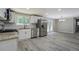 Well-lit kitchen with granite countertops, stainless appliances, and white subway tile backsplash at 4176 King Edward Dr, Douglasville, GA 30135