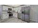 Bright kitchen featuring stainless steel appliances and white shaker cabinets at 4176 King Edward Dr, Douglasville, GA 30135