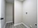 Clean laundry room with modern vinyl floors, ready for appliances to be hooked up at 4176 King Edward Dr, Douglasville, GA 30135