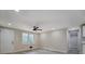 Room with wood-look flooring features a door, window and view into the kitchen at 4176 King Edward Dr, Douglasville, GA 30135