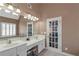 Bathroom featuring a large mirror, double vanity, and bathtub at 5810 Old Mill Trce, Lithonia, GA 30038
