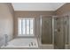 Cozy bathroom featuring a jetted tub and walk-in shower at 5810 Old Mill Trce, Lithonia, GA 30038