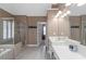 Bright bathroom featuring a separate shower, soaking tub, and double vanity at 5810 Old Mill Trce, Lithonia, GA 30038