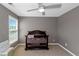 Bright bedroom with a dark wood crib, and large windows at 5810 Old Mill Trce, Lithonia, GA 30038