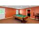 Spacious game room featuring a well-maintained pool table, perfect for entertaining guests at 5810 Old Mill Trce, Lithonia, GA 30038