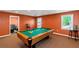 Well-lit game room with an inviting pool table, perfect for recreation and relaxation at 5810 Old Mill Trce, Lithonia, GA 30038
